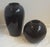 A pair of period black ceramic vases by Haeger. Excellent condition and produced in the very late 1980's into the...