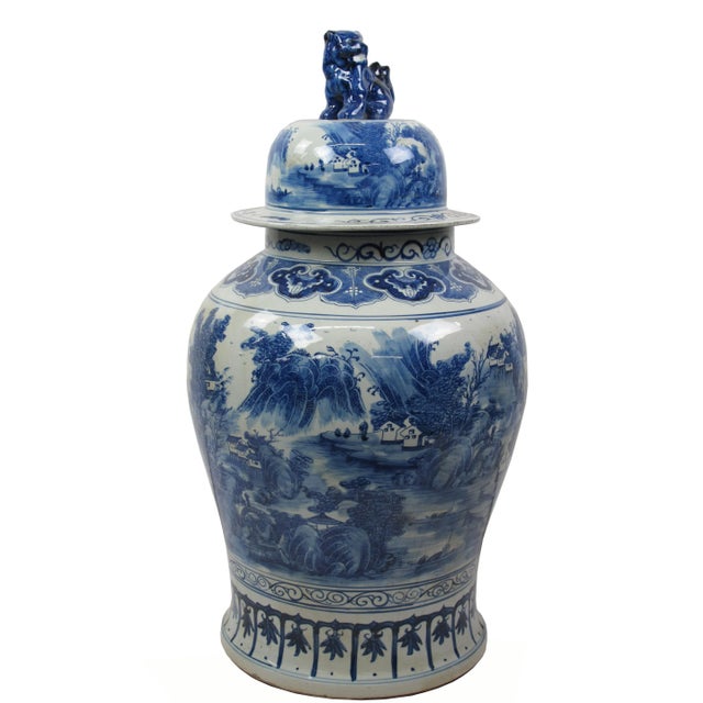 This gorgeous 35 inch high large blue and white porcelain jar is adorned with beautifully hand painted landscape....