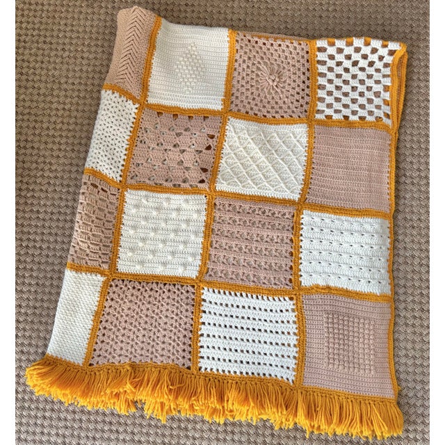 Charming handmade afghan in orange, dusty rose, and white. Most items found at Pub & Oasis are vintage and antique in...