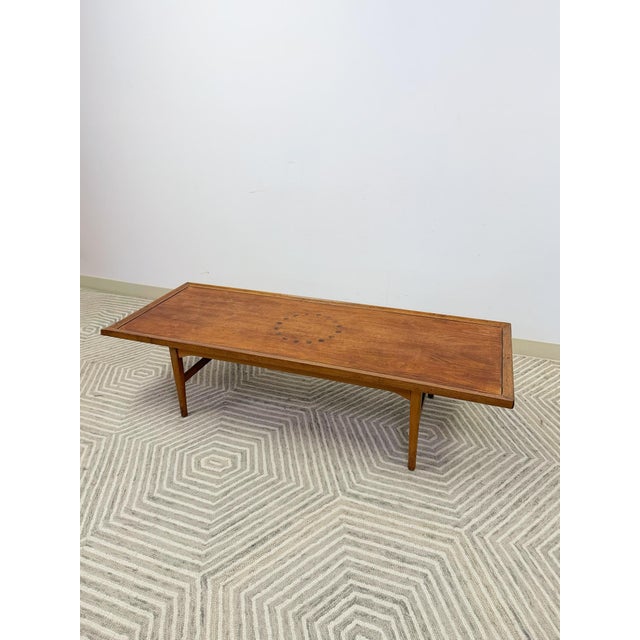 This distinctive vintage Drexel mid-century modern coffee table is a well-crafted and characterful living room piece. The...