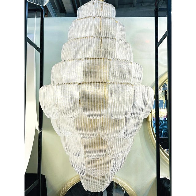 Luxury modern chandelier with sanded pink and amber ”petals” in murano glass . hand-made in murano glass , all made in...