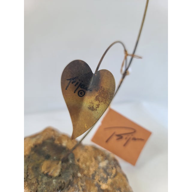 Bijan Kinetic Metal Sculpture of a Hummingbird and flower made of copper, bronze, and brass. Original hand signed by Bijan...