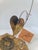 Bijan Kinetic Metal Sculpture of a Hummingbird and flower made of copper, bronze, and brass. Original hand signed by Bijan...