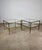 Pair of Brass and Glass Side Tables A sophisticated pair of side tables featuring an elegant brass frame and glass tops,...