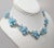 Metal Vintage Signed Kramer Blue Flowers & Clear Rhinestone Necklace, Vogue 1955 For Sale - Image 7 of 11