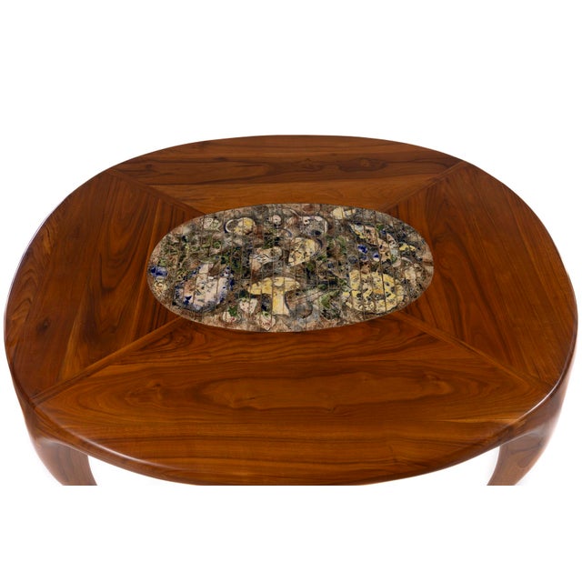 Sculptural Allen Ditson and Lee Porzio dining table in solid walnut with oval inset of Porzio's signature ceramic tile...