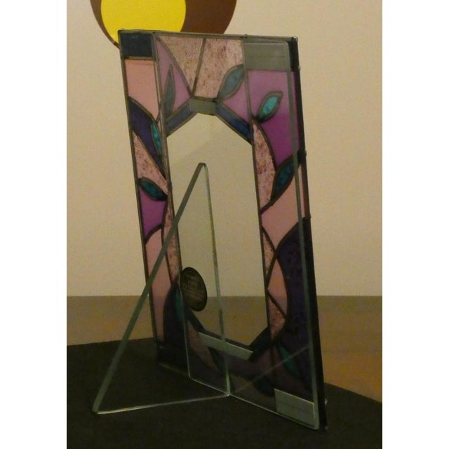 Restoration of a table portrait frame with the possibility of also being used as a frame. On the back of the base there...