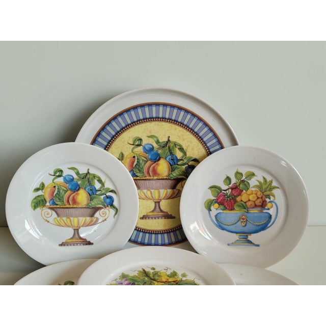 Limoges porcelain pie and platter set. Includes 6 dessert plates (30 cm diameter) and 1 platter (20.8 cm diameter)....