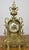 A beautifully detailed Vintage brass clock with an ornate decorative design and elegant period styling throughout. This...