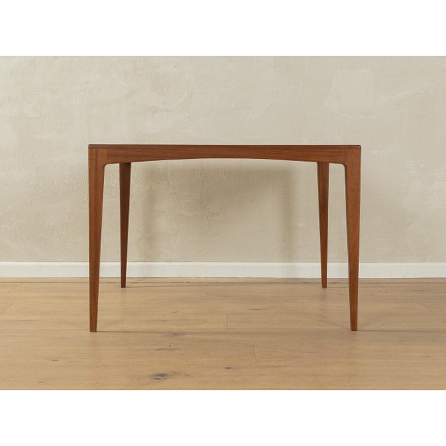 Classic coffee table from the 1950s by Franz Xaver Lutz for WK Möbel. Solid frame and veneered teak table top with solid...