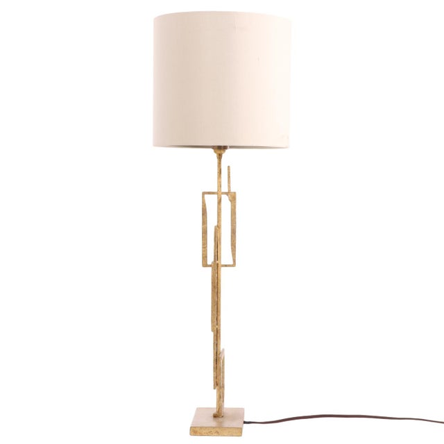 A contemporary “Salperton” table lamp by Porta Romana, crafted in bronze-tone metal and paired with a silk hardback oval...