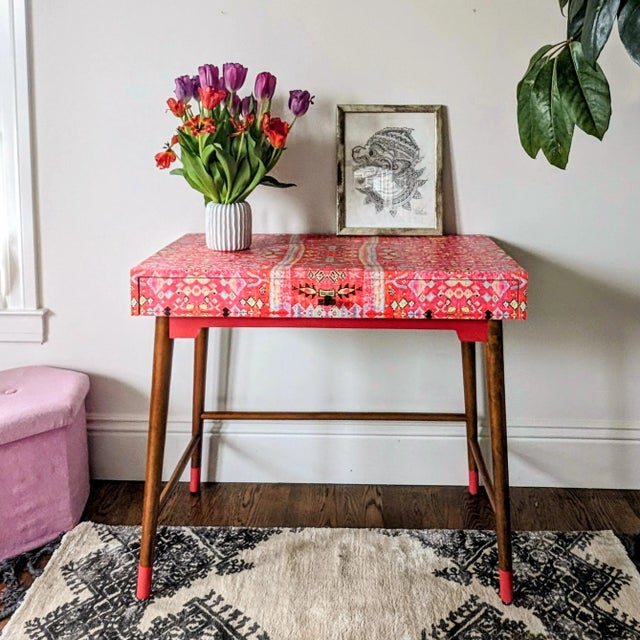 Mid century style desk or console table with single lined drawer. Desk case and drawer front wrapped in “Tropical Sunrise”...
