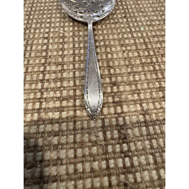 Wonderful antique bonbon spoon / nut server in the Lady Betty pattern signed Jennings Silver Co. This pattern was...