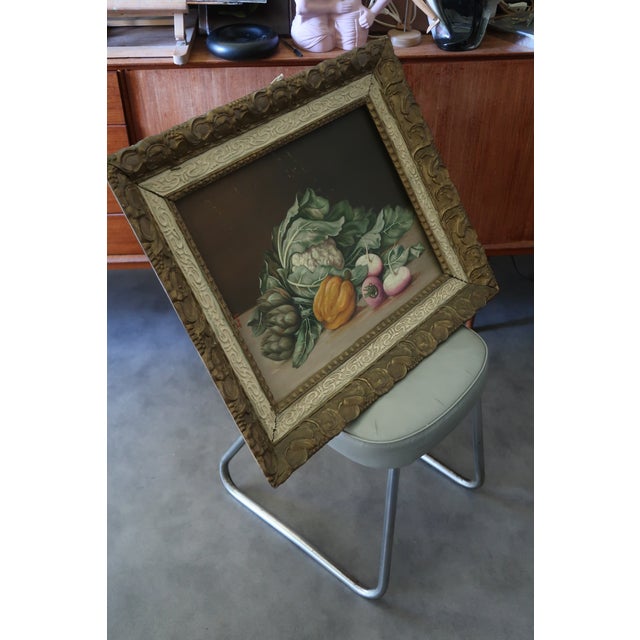 Beautiful vintage Italian still life painting on wood panel, presented in an impressive antique decorative frame. This...