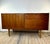 Small vintage Scandinavian teak sideboard dating from the 1960s. Its clean and timeless design is characterized by simple...
