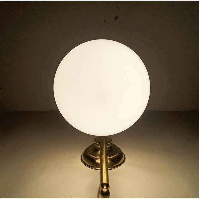 A most delightful masterwork of ambiental arts, sculptural brass sconce, depicting a street gas light, base made of...