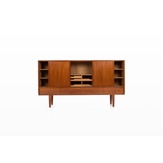 Danish vintage highboard in teak designed by henning kjaernulf for vejle stolefabrik, featuring beautifully figured...
