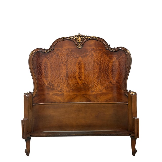 An elegant antique French Louis XV style twin bed crafted in beautifully figured flame mahogany with graceful serpentine...
