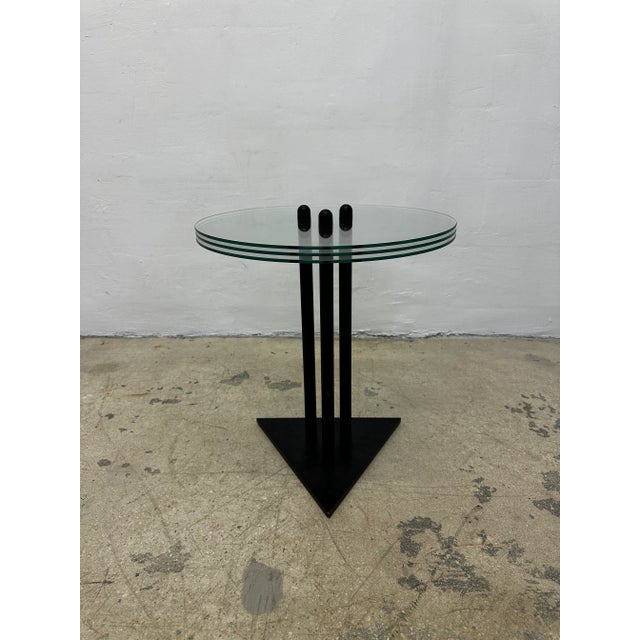 Postmodern black lacquered steel side or end table with three stacked pieces of glass designed and manufactured by Becker...