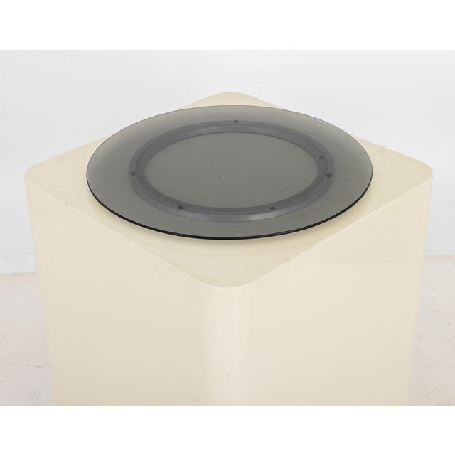 Modern Industrial White Patinated Metal Pedestal, with circular smoky glass swivel top. 43" H x 24" W x 24" D. Provenance:...