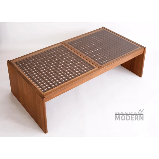 Stunning glass coffee table by Komfort of Denmark with a lattice grid design. The coffee table consists of two inset...