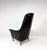 Mid-Century Scandinavian Modern Black Leather High-Back Lounge Chair. Sculptural high back with gently curved armrests...