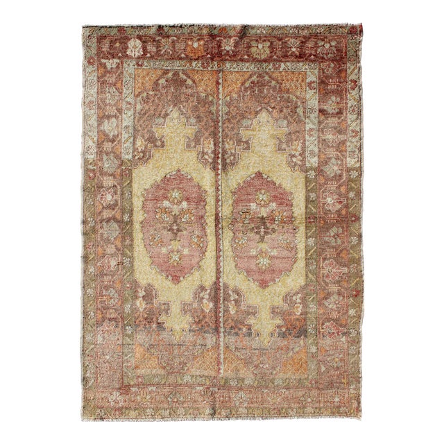 Vintage Oushak Rug With Two Medallion Panels in Yellow, Brown, Orange and Soft Red For Sale
