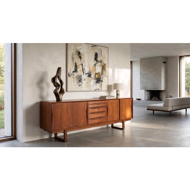 Elegant Danish teak sideboard produced by Skovby Møbelfabrik in the 1960s and attributed to Arne Vodder. Featuring four...