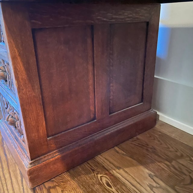 Victorian intricately carved oak freestanding kneehole desk with one long middle drawer and four graduating drawers on...