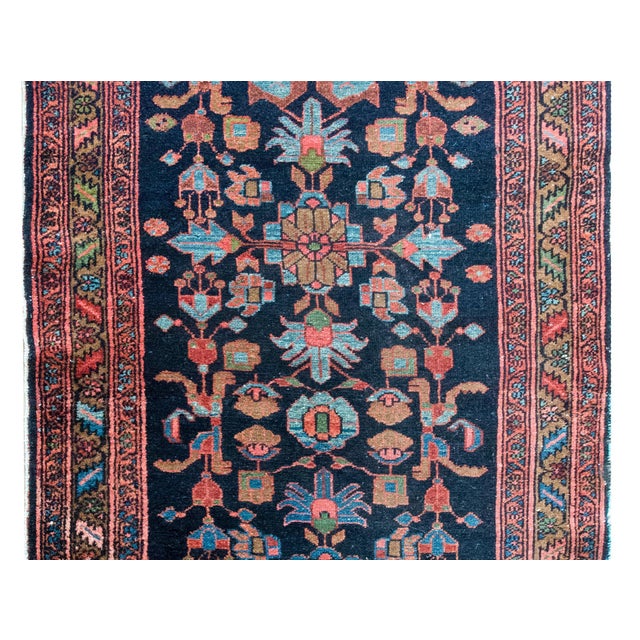 A wonderful early 20th century Persian Malayer rug with a bold stylized floral pattern woven in myriad colors including...