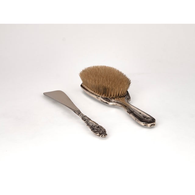 This fine, two piece ensemble from the early 20th century edwardian era combines american and british silversmithing in a...