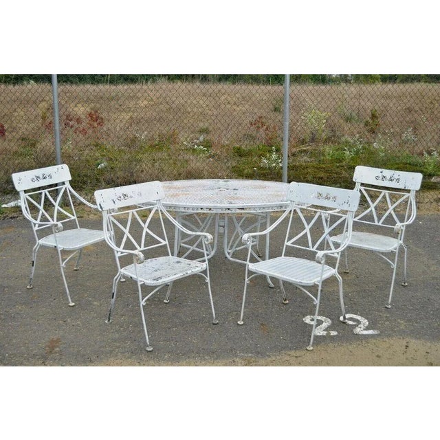 Vintage Wrought Iron Salterini Style Garden Patio Dining Set - 5 Pc Set. Item features 4 curule armchairs with cut-out...