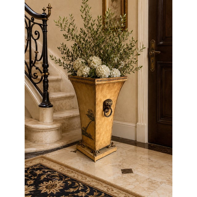A distressed chinoiserie-style planter that can also be used as an umbrella holder basket. This makes for an elegant...