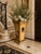 A distressed chinoiserie-style planter that can also be used as an umbrella holder basket. This makes for an elegant...