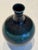 An exceptional piece of mid-century Japanese ceramic artistry, this sculptural porcelain tokkuri form originates from the...