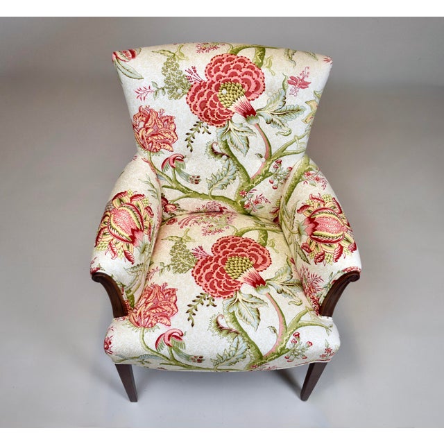 A fully restored vintage Mahogany accent chair, Regency in style with carved scroll arms, tapered and splayed legs...