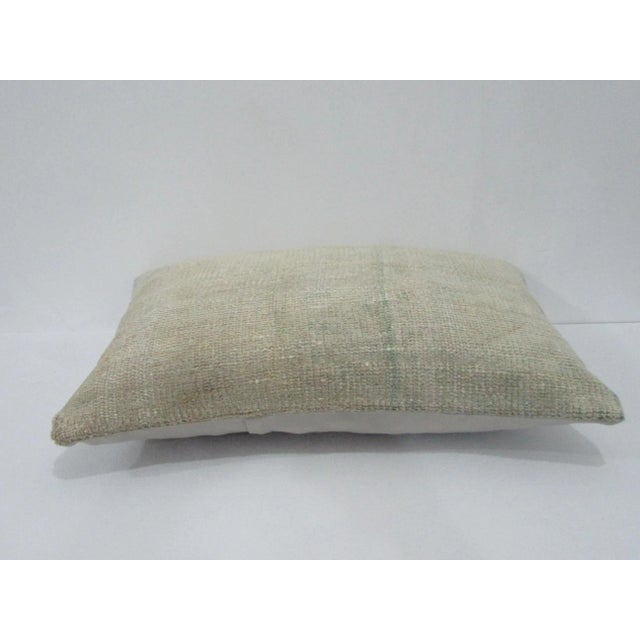 Decorative pillow cover made from a vintage Turkish handknotted rug. Backed with good quality cotton fabric. Pillow...