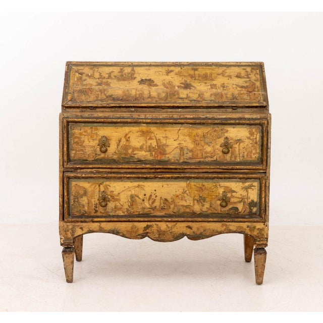 Venetian Chinoiserie Painted Secretaire, with figural and landscape scene motif, and fall front writing surface opening to...