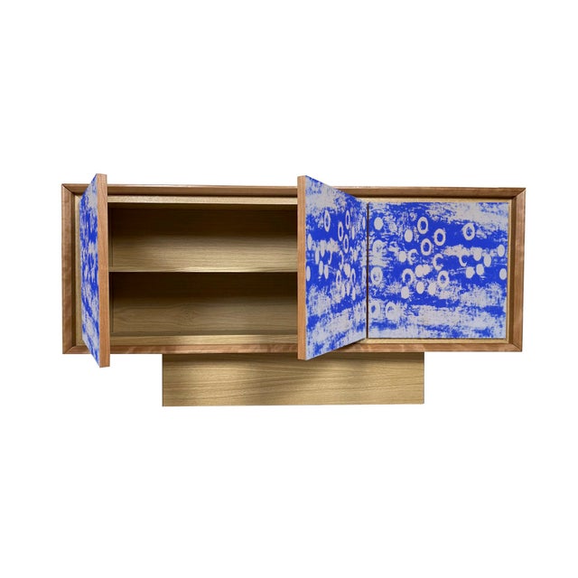 "Disegno Quattro" sideboard, 2026, by Meccani Studio for Meccani Design. A beautiful oak sideboard with cherry and walnut...