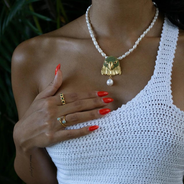 The Radiant Duo Turquoise Gold Adjustable Ring captures the essence of the ocean with its vibrant turquoise gemstones....