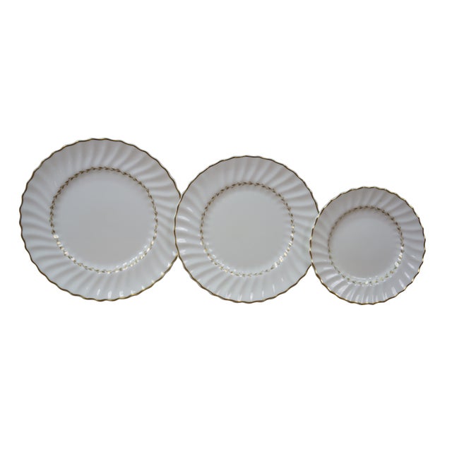 36 Vintage Royal Doulton Adrian H4816 bone china dinner service plates, recognized by their white, fluted, swirl pattern...