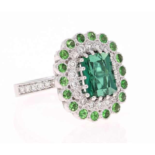 Gorgeous is an under-statement for this beauty! This ring has a Emerald Cut Green Tourmaline that weighs 2.81 Carats....