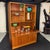 A wonderfully versatile piece of Danish design that functions as bookcase, bar, and writing desk in one sculptural form....