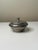 A streamlined pewter lidded box by Ernst Svedbom, Sweden, dated 1932. Featuring a rounded stepped form with a simple...