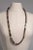 Wear long or double it up short, a multi-color, faceted 12mm tourmaline beaded necklace. Features pave`-set diamond end...