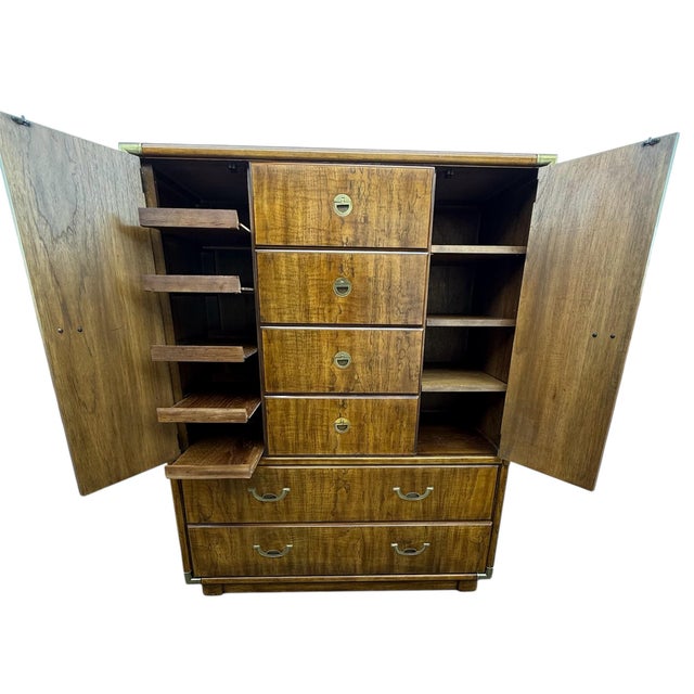 Vintage Gentlemen’s chest by Drexel with beautiful natural grain and classic brass campaign-style hardware. Features...