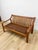 This cognac-toned bench captures the sculptural, organic quality that defines Danish Modern design, offering a two-seat...