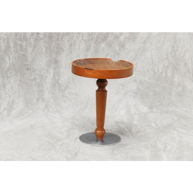 Walnut wood, glass and stainless steel base of 2 cm.