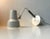 This is a white and grey table lamp designed by Jac Jacobsen for his own company Jac Jacobsen A/S in Norway during the...