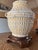 A pristine pair of vintage Wildwood Accents Ceramic table lamps. Cream and yellow glaze on chinoiserie style rattan...